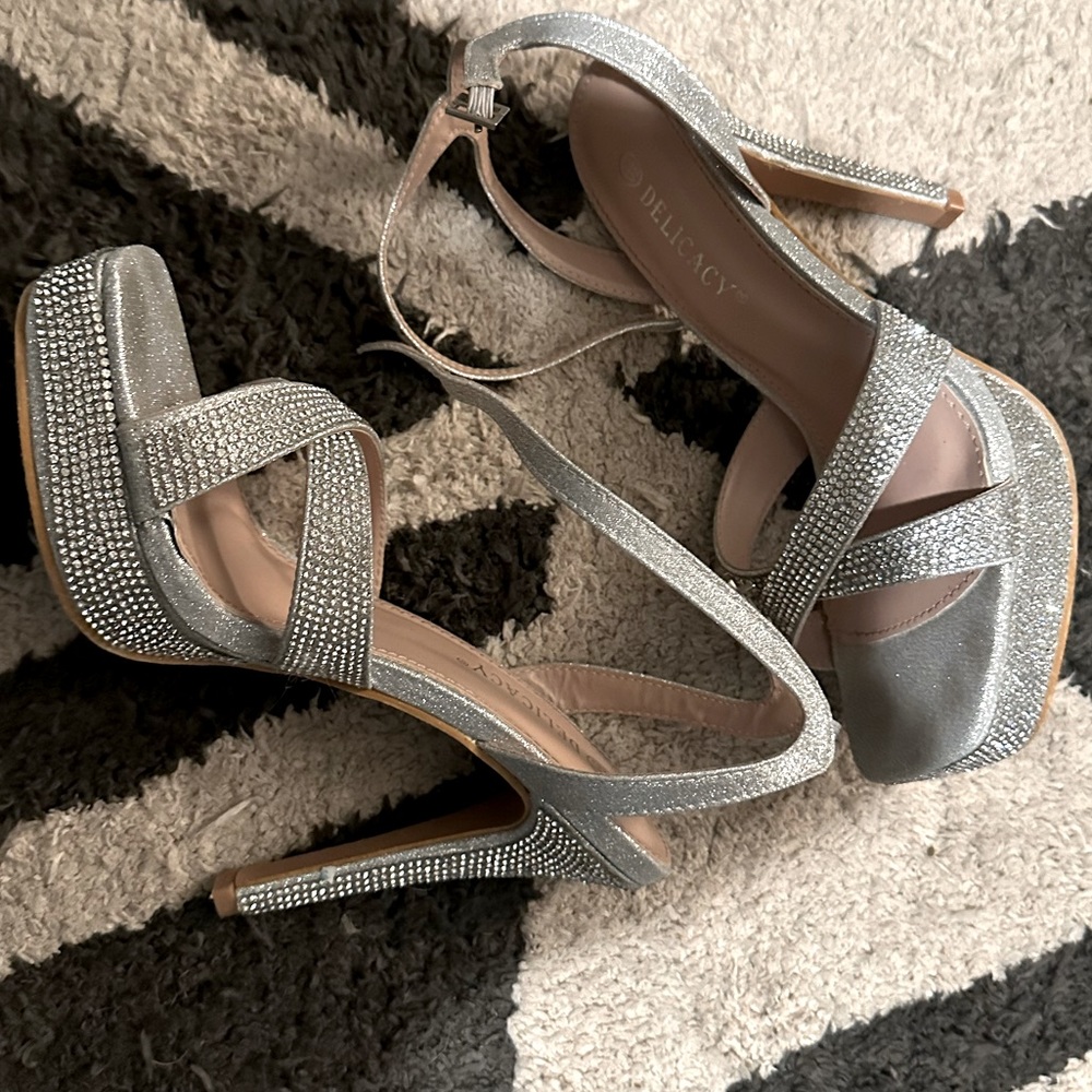 Silver heels worn once with slight wear and tear still great condition